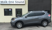Silver 2015 Nissan Rogue with premium window tint film